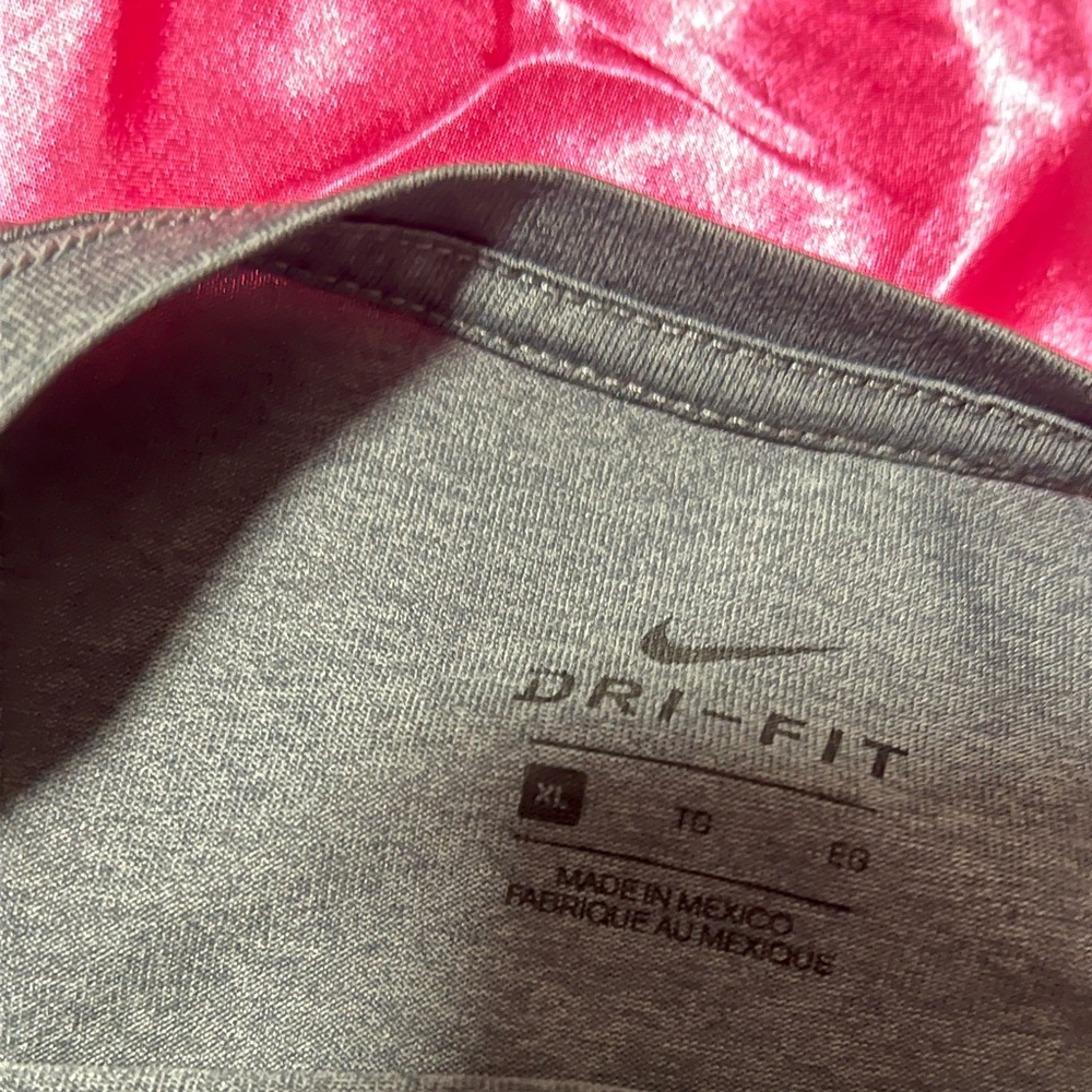 NIKE long sleeve grey shirt. Size XL in boys. I as a girl got it though lol.